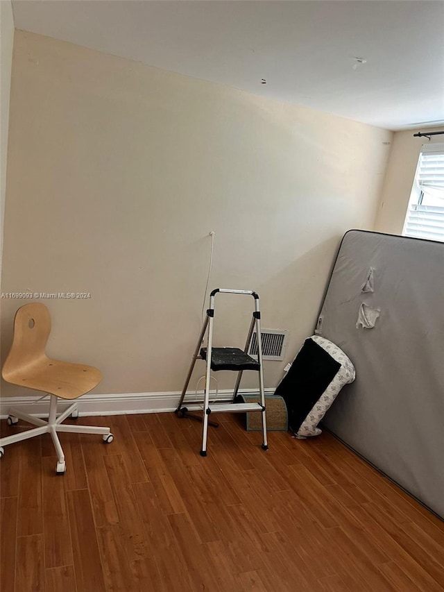 miscellaneous room featuring hardwood / wood-style flooring