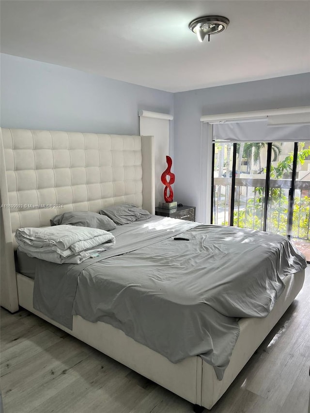 bedroom with wood-type flooring