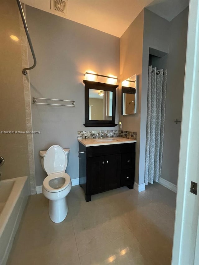 full bathroom with tile patterned flooring, shower / tub combo, vanity, and toilet