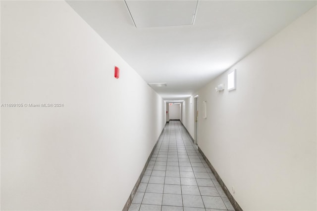 corridor featuring light tile patterned floors