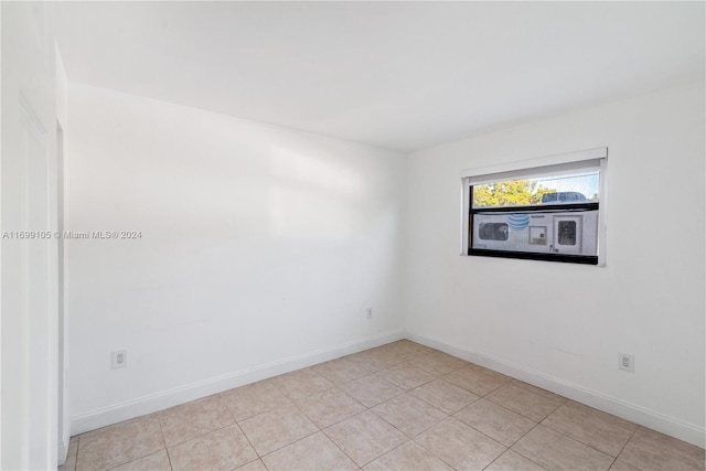 spare room featuring light tile patterned floors