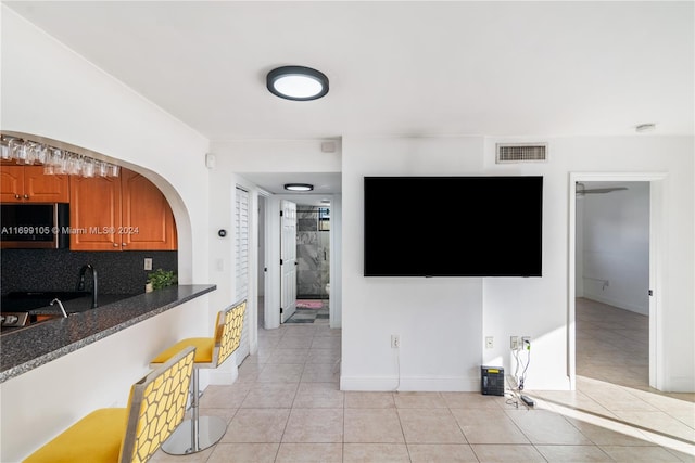 interior space featuring light tile patterned floors