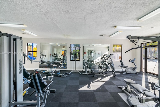 gym with a textured ceiling