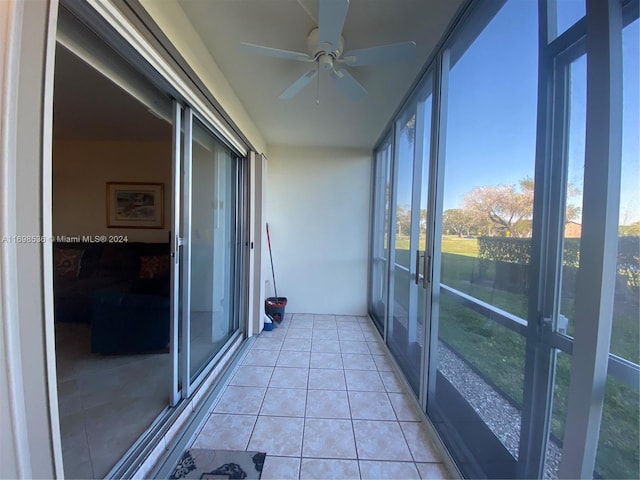 unfurnished sunroom featuring french doors and ceiling fan