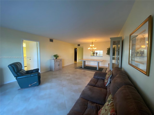 901 SW 128th Ter Unit 103A, Pembroke Pines, FL 33027 - living room featuring a chandelier