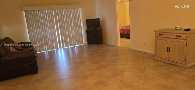 901 SW 128th Ter Unit 103A, Pembroke Pines, FL 33027 - spare room featuring baseboards and light tile patterned flooring