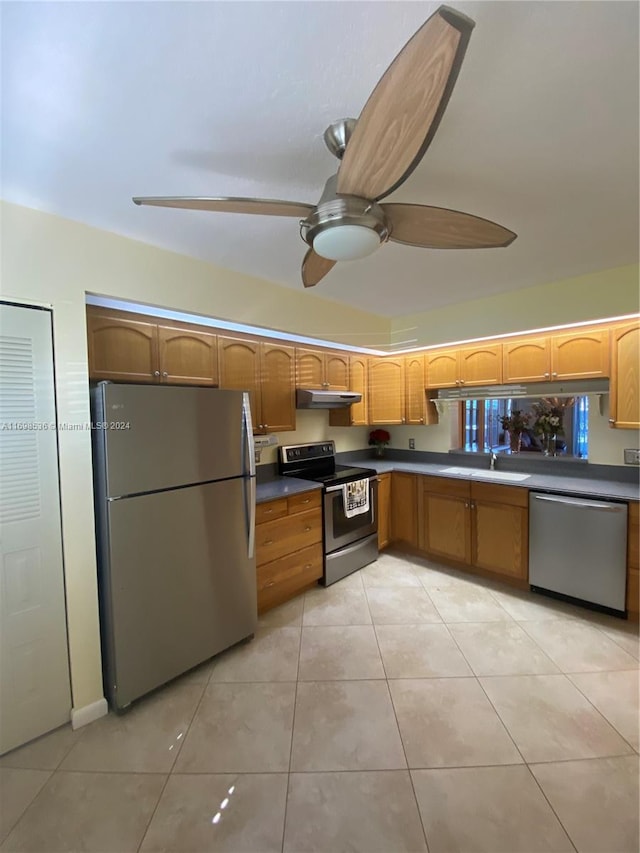 kitchen with ceiling fan, sink, light tile patterned floors, and appliances with stainless steel finishes