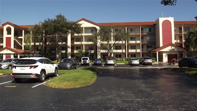 901 SW 128th Ter Unit 103A, Pembroke Pines, FL 33027 - view of apartment building / complex featuring uncovered parking
