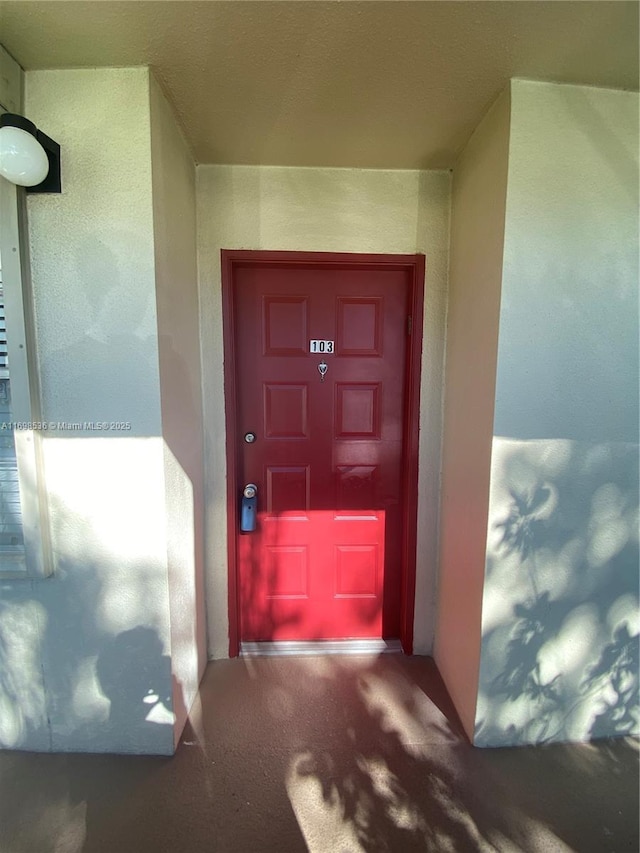901 SW 128th Ter Unit 103A, Pembroke Pines, FL 33027 - view of exterior entry with stucco siding