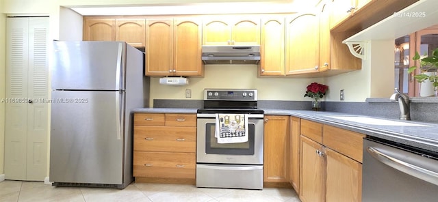 901 SW 128th Ter Unit 103A, Pembroke Pines, FL 33027 - kitchen with appliances with stainless steel finishes, under cabinet range hood, and light tile patterned flooring