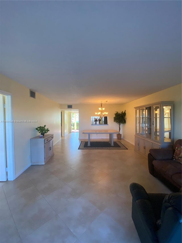 living room featuring a notable chandelier