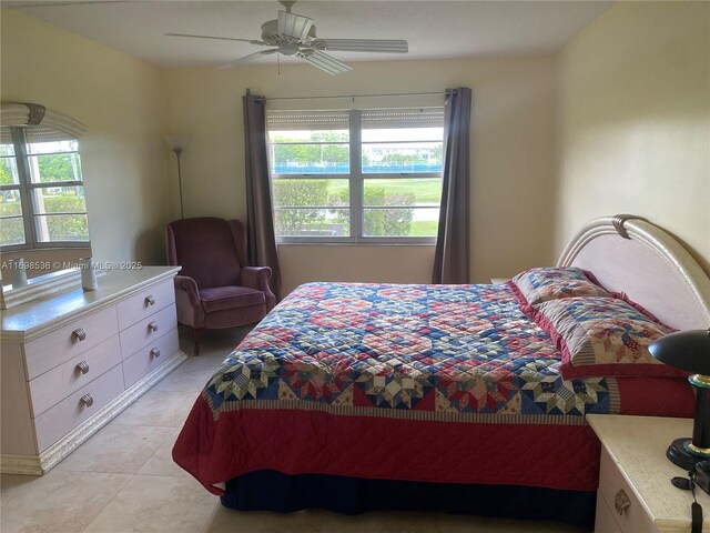 901 SW 128th Ter Unit 103A, Pembroke Pines, FL 33027 - bedroom with light tile patterned floors and a ceiling fan