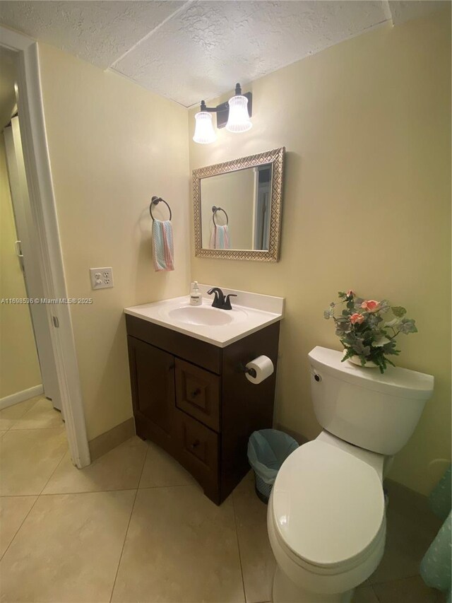 901 SW 128th Ter Unit 103A, Pembroke Pines, FL 33027 - bathroom featuring vanity, tile patterned floors, and a textured ceiling