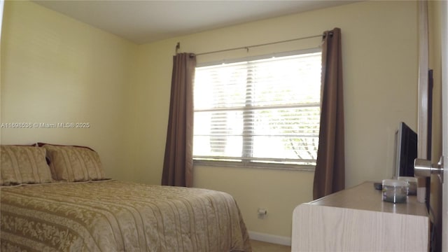 901 SW 128th Ter Unit 103A, Pembroke Pines, FL 33027 - bedroom featuring baseboards