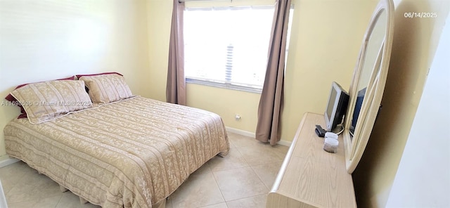 901 SW 128th Ter Unit 103A, Pembroke Pines, FL 33027 - bedroom featuring light tile patterned floors and baseboards