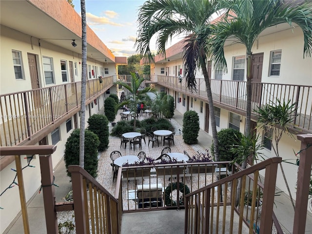 view of balcony at dusk