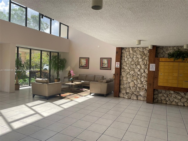 tiled living room with a towering ceiling and a textured ceiling