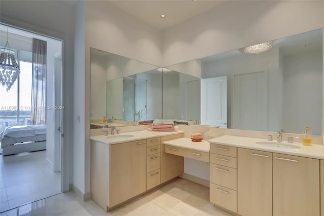 bathroom featuring tile patterned flooring and vanity