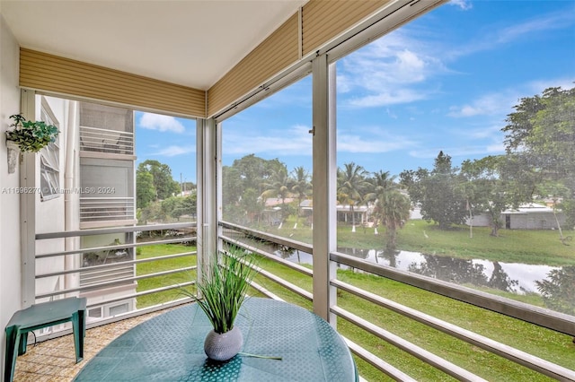 sunroom with a water view