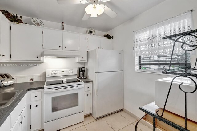 kitchen with white appliances, ceiling fan, sink, white cabinets, and light tile patterned flooring