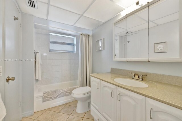 full bathroom featuring vanity, tile patterned flooring, shower / bathtub combination with curtain, and toilet