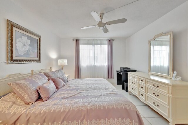 tiled bedroom with multiple windows and ceiling fan