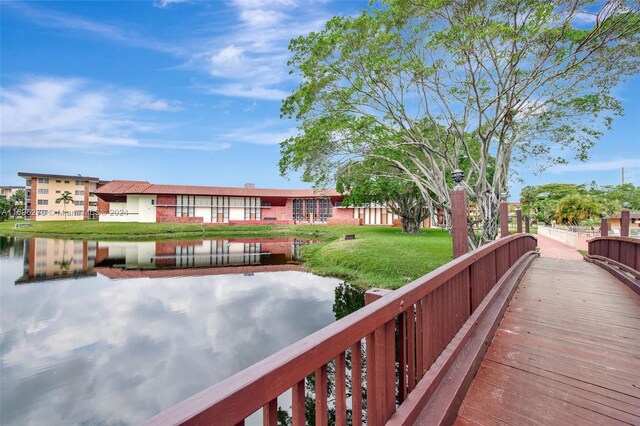 exterior space featuring a yard and a water view