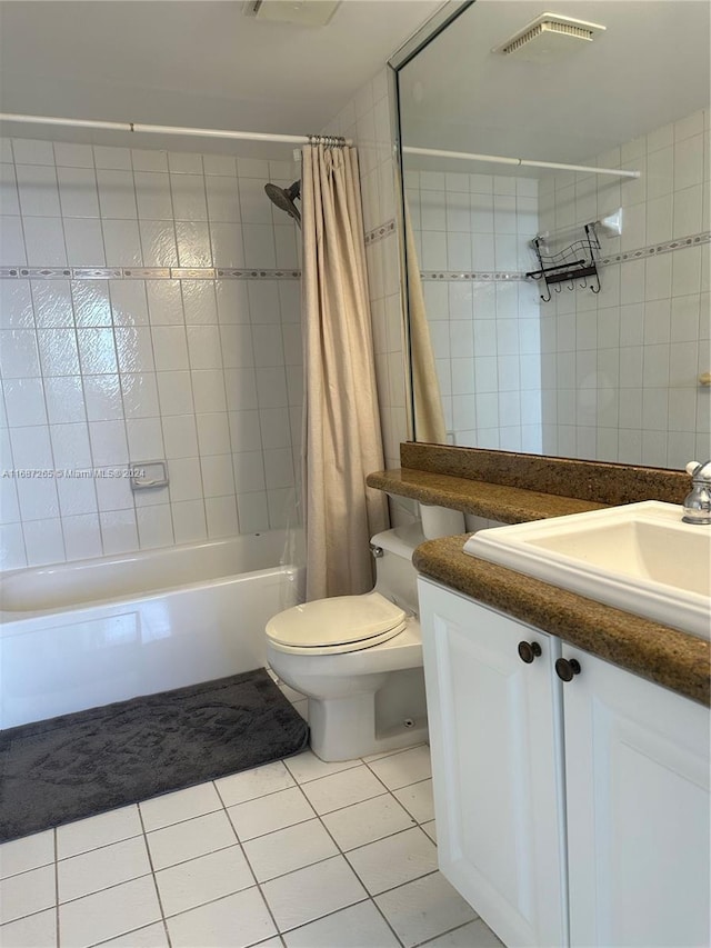 full bathroom with tile patterned floors, vanity, shower / bath combination with curtain, and toilet