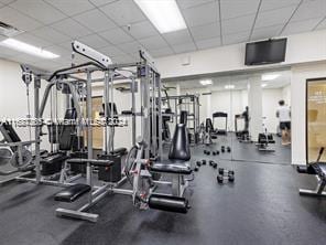 gym featuring a drop ceiling