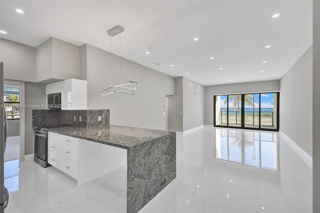 kitchen featuring white cabinetry, hanging light fixtures, dark stone countertops, kitchen peninsula, and stainless steel electric stove