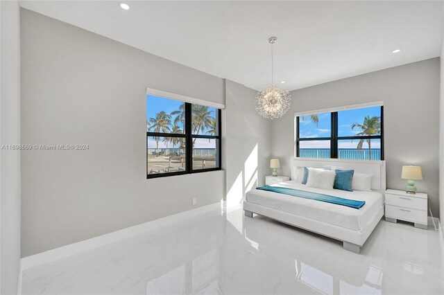 bedroom with an inviting chandelier