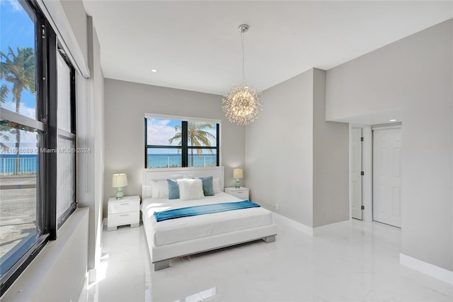 bedroom featuring a notable chandelier