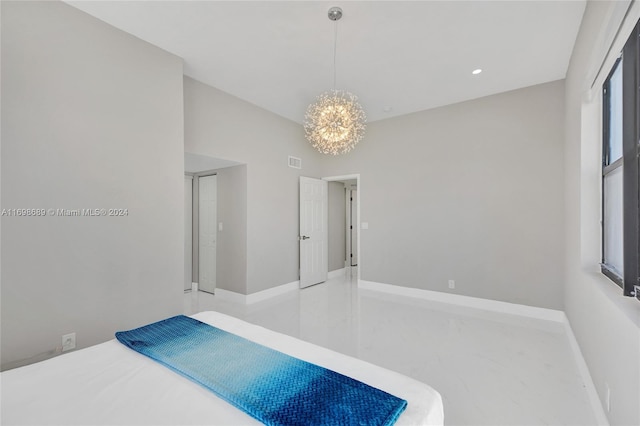 bedroom with an inviting chandelier