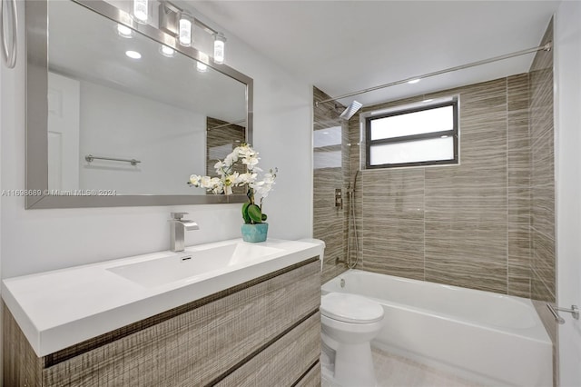 full bathroom with tile patterned flooring, vanity, toilet, and tiled shower / bath