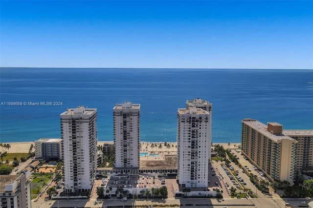 birds eye view of property featuring a water view and a view of the beach