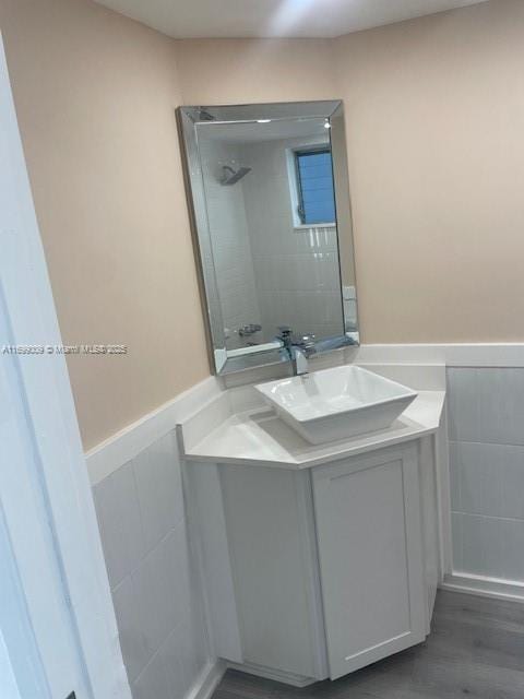 bathroom with wood-type flooring and vanity