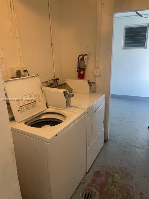 washroom featuring washer and dryer