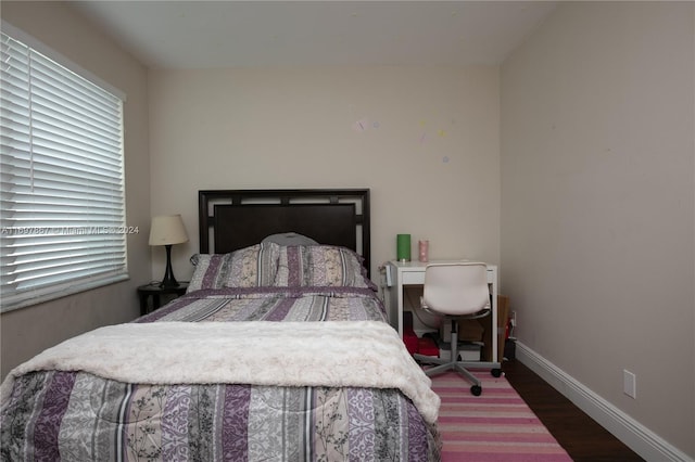 bedroom featuring hardwood / wood-style floors