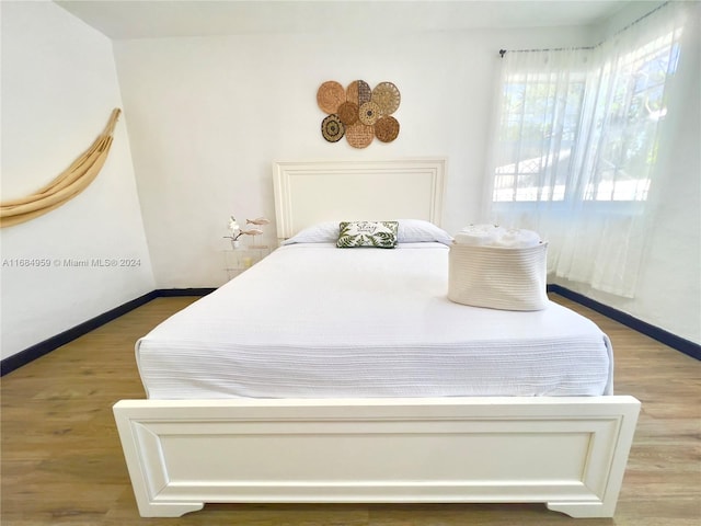 bedroom with light hardwood / wood-style flooring