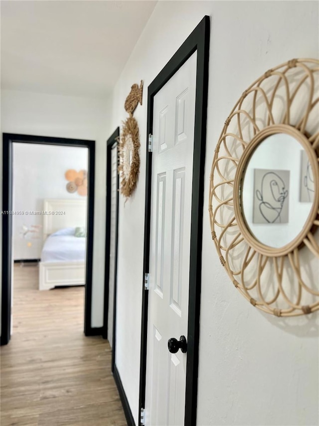 corridor featuring light hardwood / wood-style floors