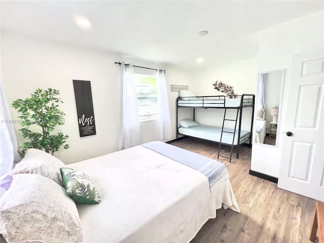 bedroom with hardwood / wood-style floors