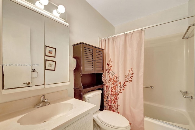 full bathroom featuring shower / bath combo with shower curtain, vanity, and toilet