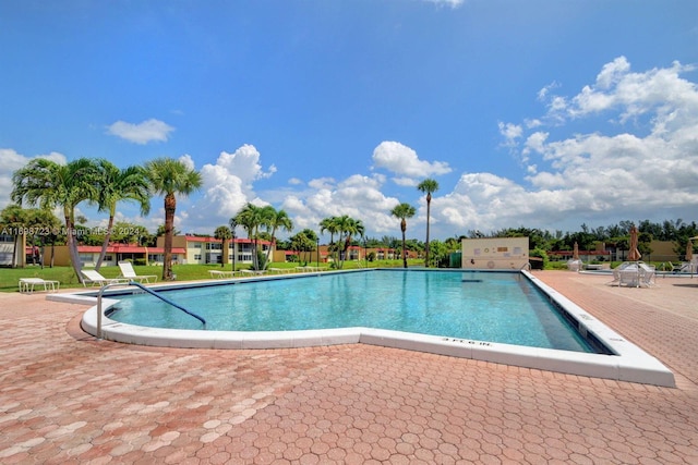 view of swimming pool with a patio