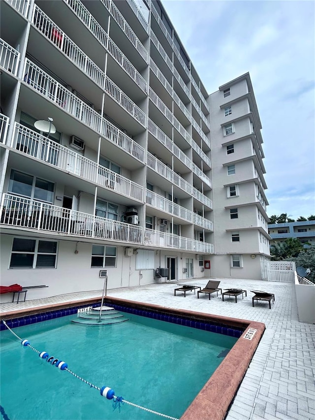 view of swimming pool featuring central AC unit