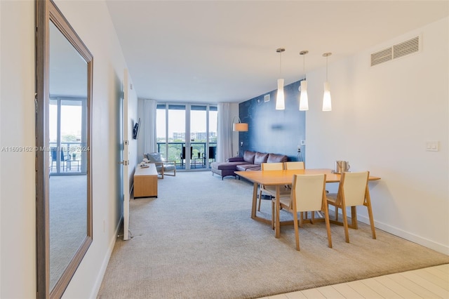 dining area with light carpet