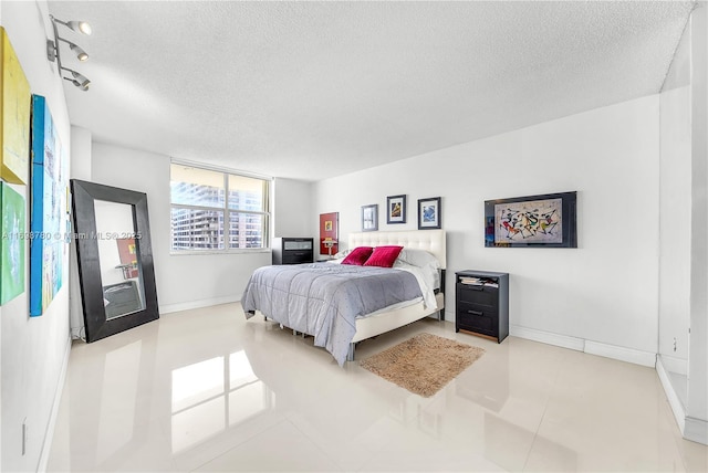 bedroom featuring a textured ceiling