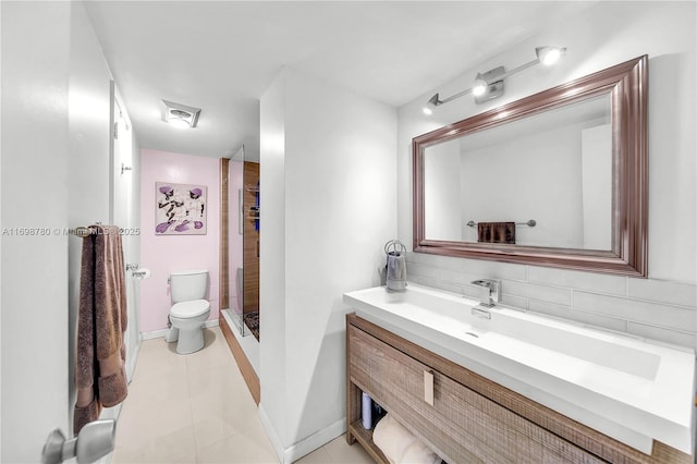 bathroom featuring vanity, decorative backsplash, tile patterned floors, toilet, and walk in shower