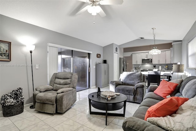 tiled living room featuring ceiling fan and lofted ceiling