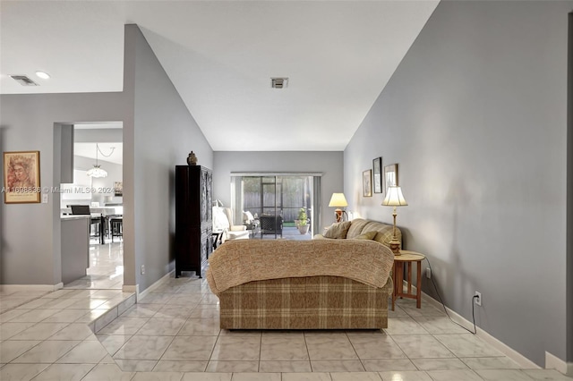 tiled bedroom with lofted ceiling