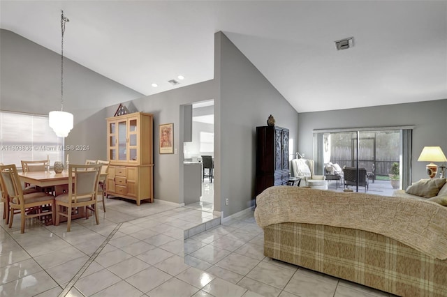 tiled bedroom with access to exterior and lofted ceiling